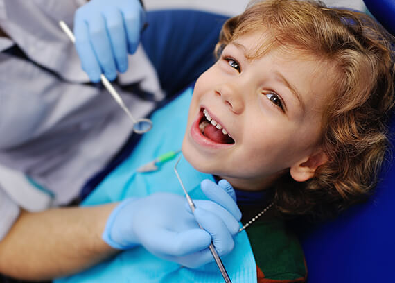 Happy child in dental chair